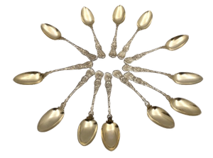 Durgin Set of 12 Gilt Sterling Silver Teaspoons in Heraldic Pattern