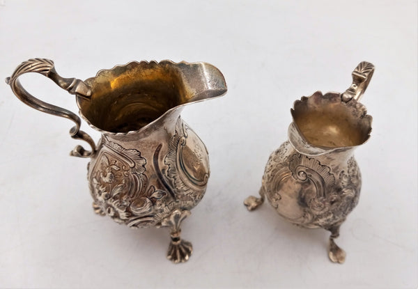 Pair of English Silver Georgian Cream Pitchers on Shell Legs with Floral Pattern